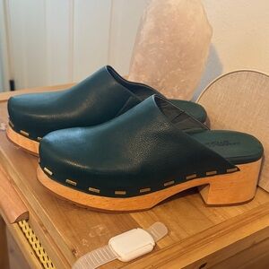 Charlotte Stone green leather clogs gold accent